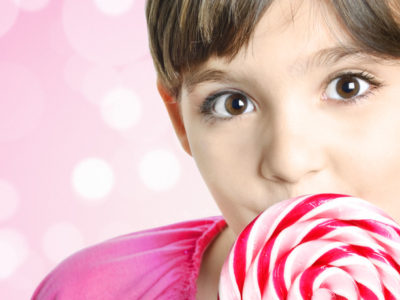 Global Confectionery girl with pink lollipop