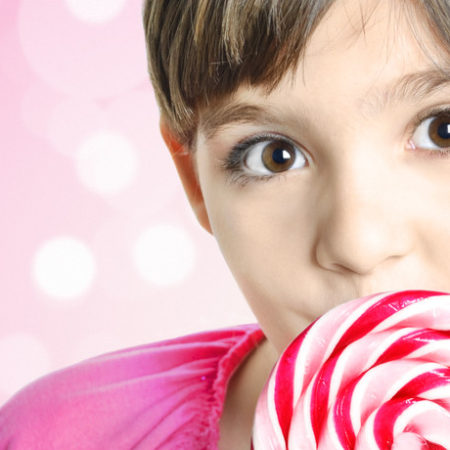 Global Confectionery girl with pink lollipop